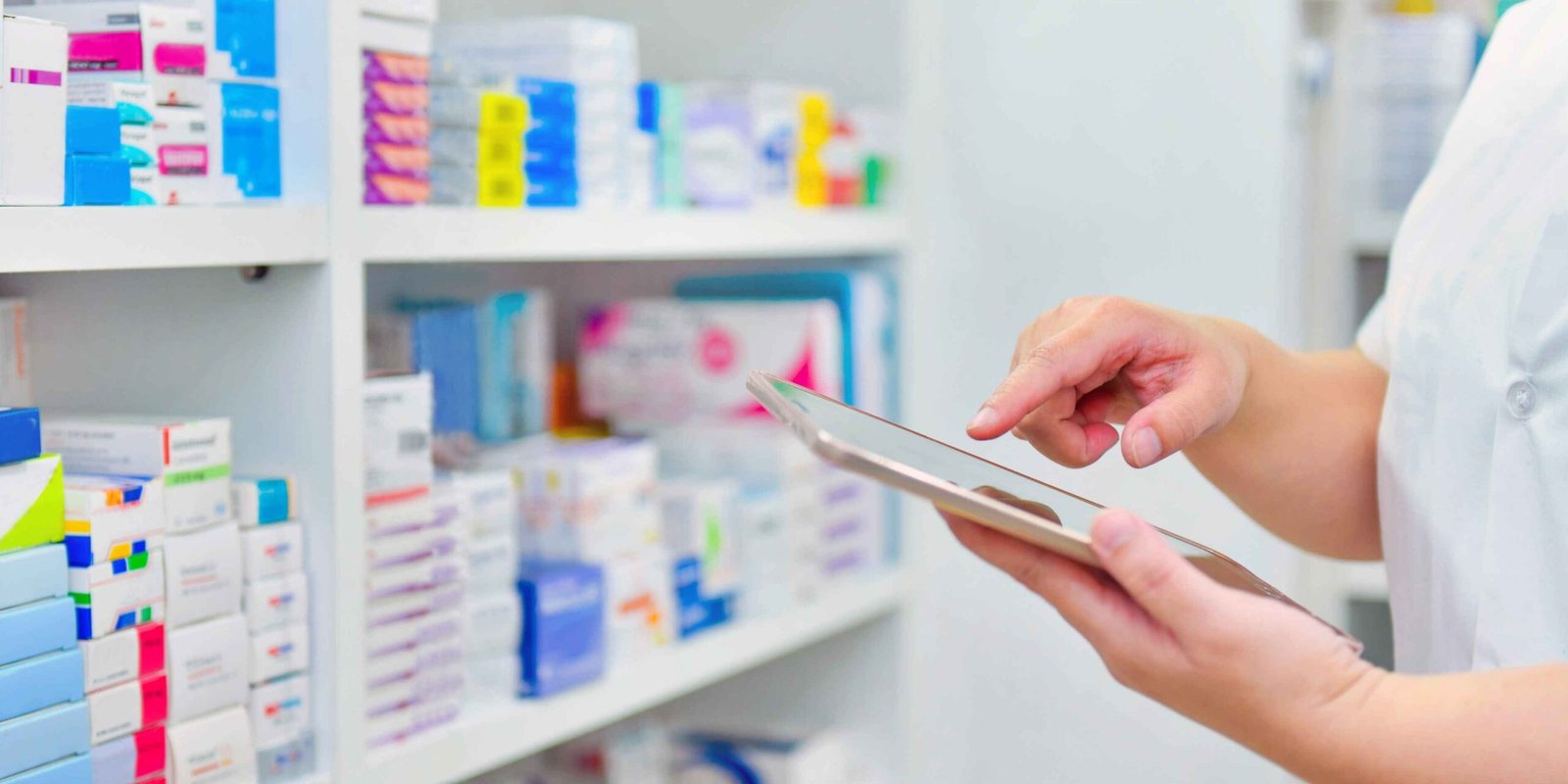 Pharmacist packing medicine for free home delivery at Shifa Al Jazeera Medical Centre in Rolla, Sharjah