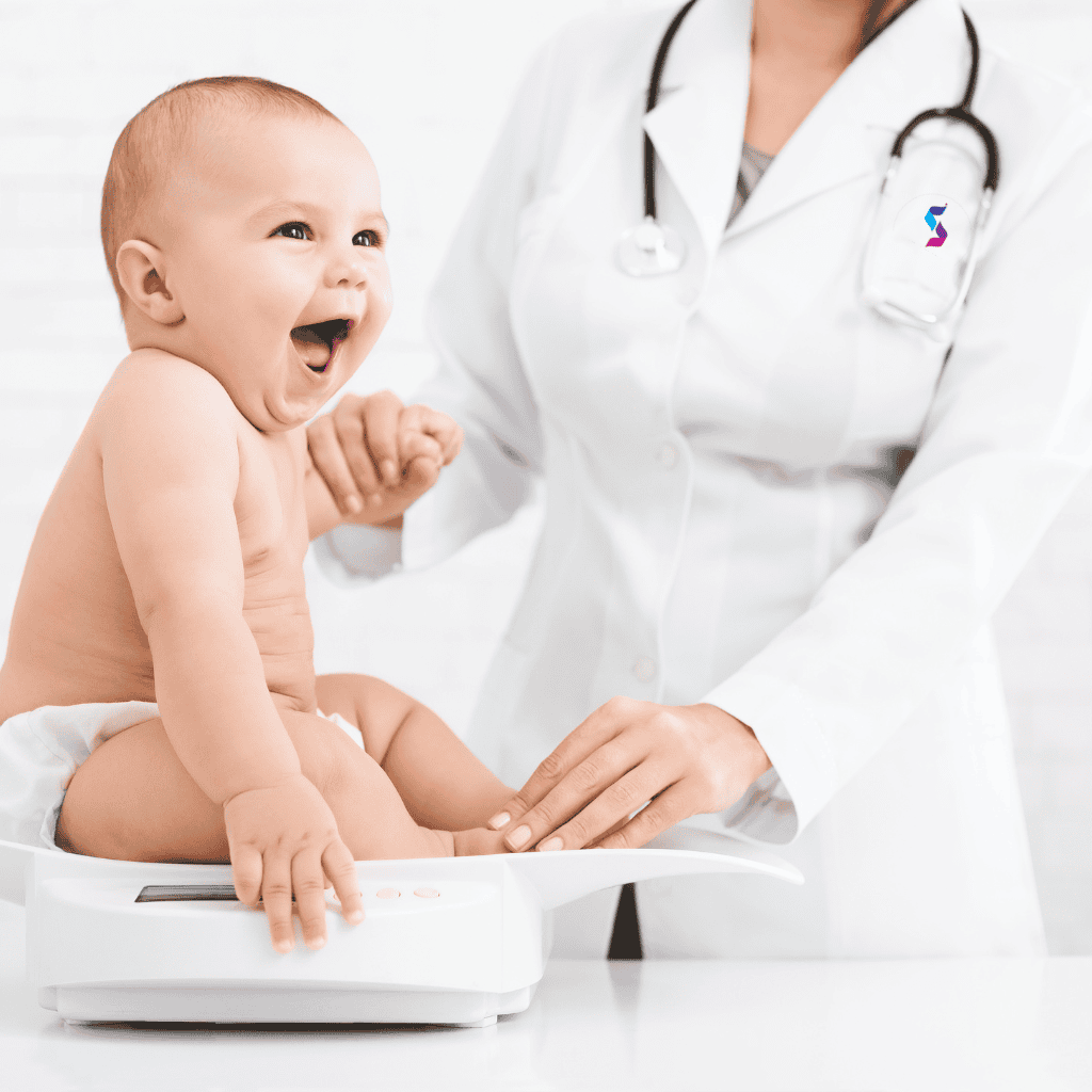 Pediatrician checking baby weight during regular checkup at Shifa Al Jazeera Clinic in Sharjah
