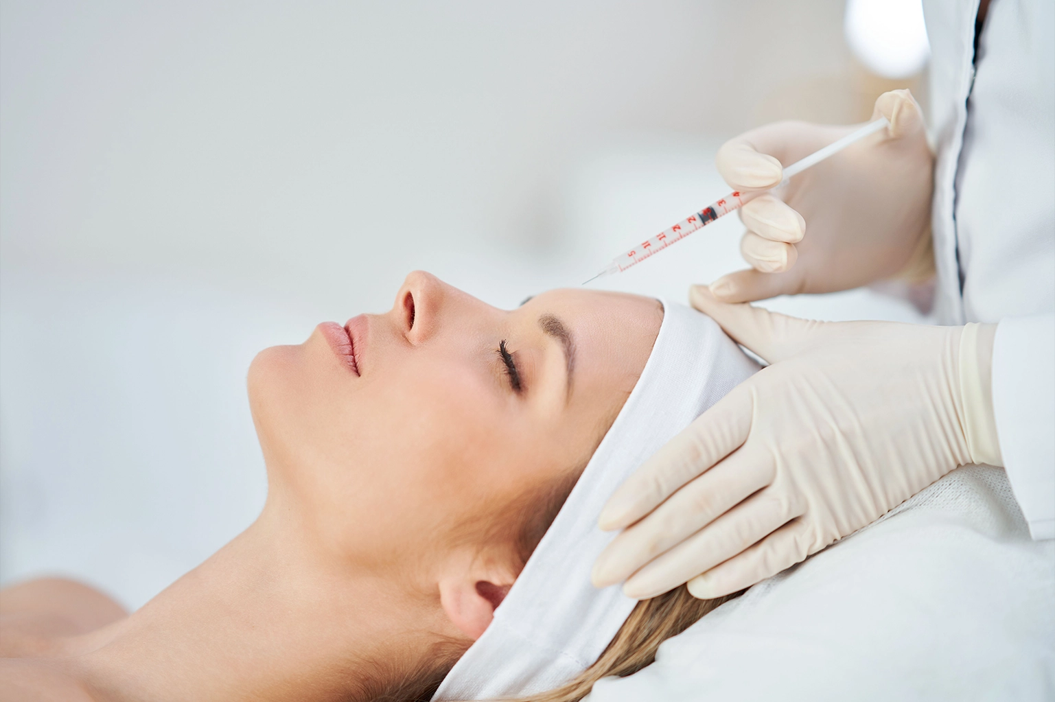 Woman receiving a Skin tightening injection from a dermatologist at Shifa Al Jazeera Medical Centre, Muwaileh